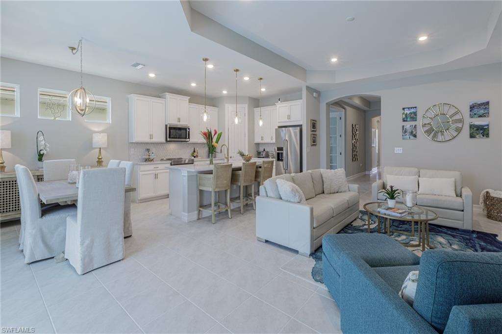 14614 Stillwater Way Naples, FL 34114 - Photo 22 of 47 a living room with furniture and a view of kitchen
