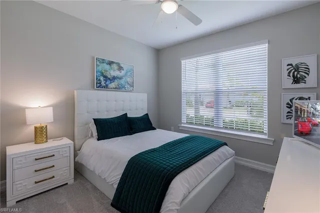 a bed room with a bed and a dresser