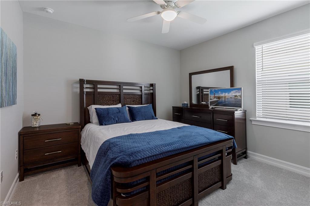 14614 Stillwater Way Naples, FL 34114 - Photo 26 of 47 a bed room with a bed and a dresser