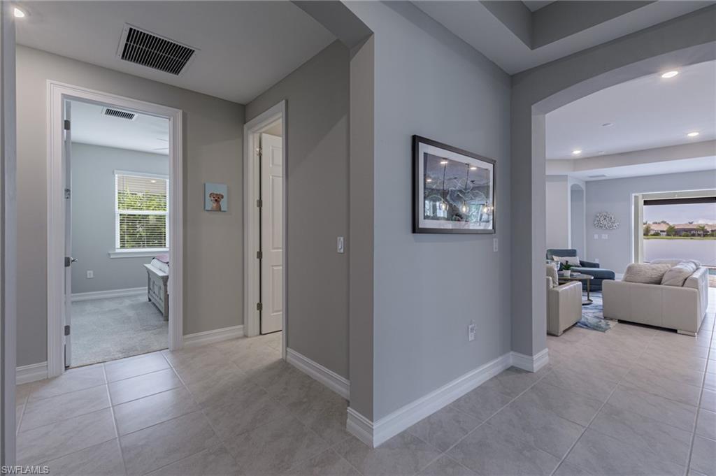 14614 Stillwater Way Naples, FL 34114 - Photo 28 of 47 wooden floor and windows in a room