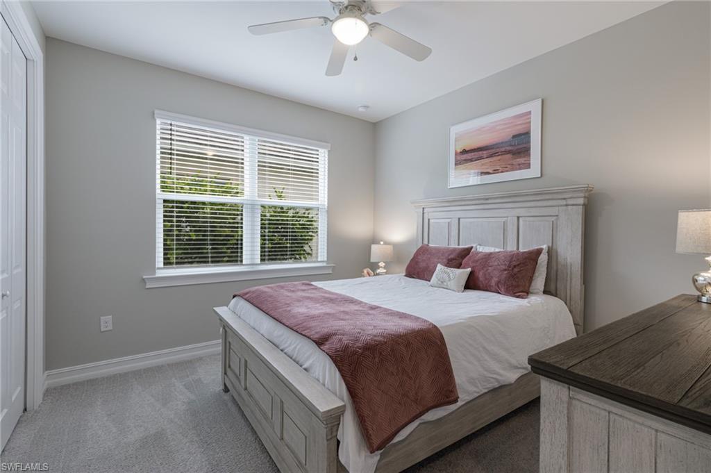 14614 Stillwater Way Naples, FL 34114 - Photo 29 of 47 a bedroom with a bed and a window