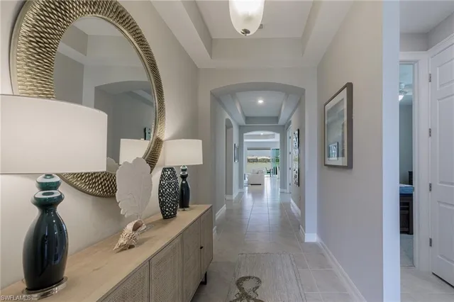 a spacious bathroom with a double vanity sink and mirror