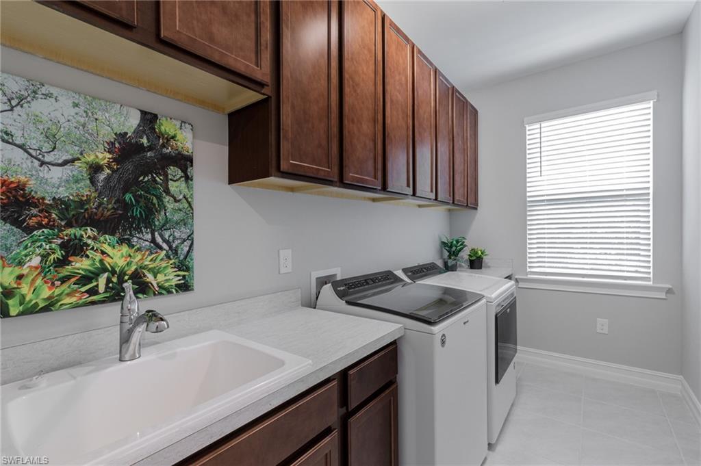 14614 Stillwater Way Naples, FL 34114 - Photo 31 of 47 a kitchen with a sink and cabinets