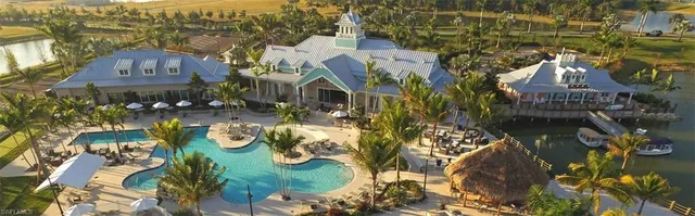 a view of a swimming pool with a table and chairs