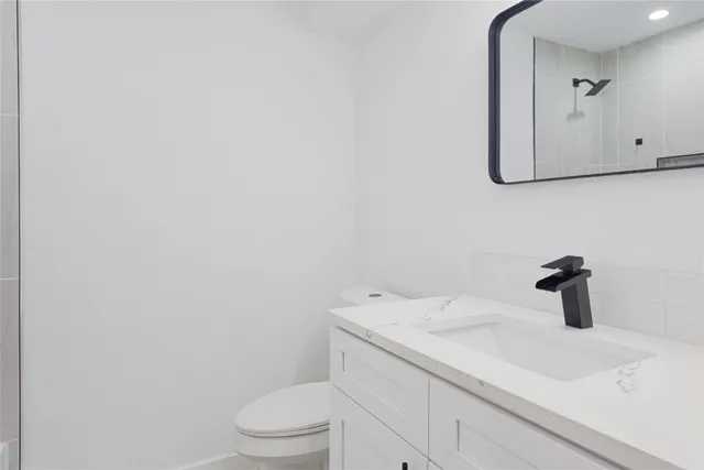 a bathroom with a sink and toilet
