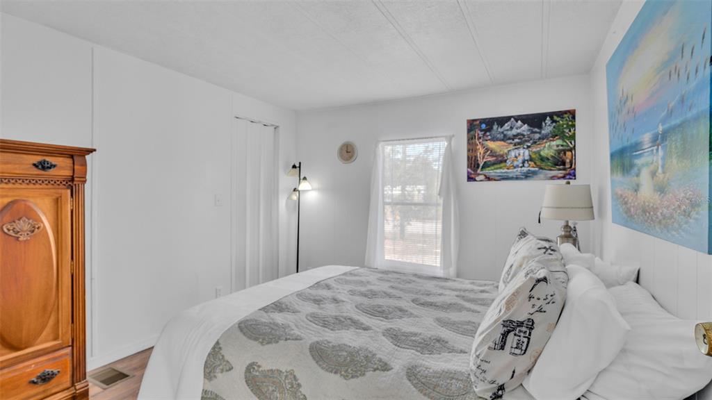 13035 Jack Terrace Hudson, FL 34669 - Photo 12 of 18 a bedroom with a bed and a window