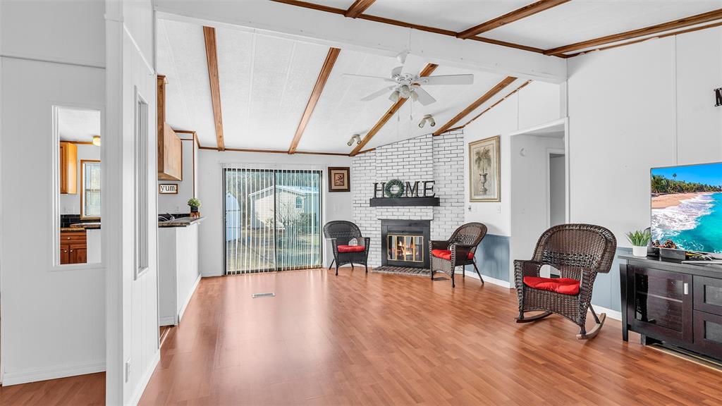 13035 Jack Terrace Hudson, FL 34669 - Photo 5 of 18 a living room with furniture and a wooden floor