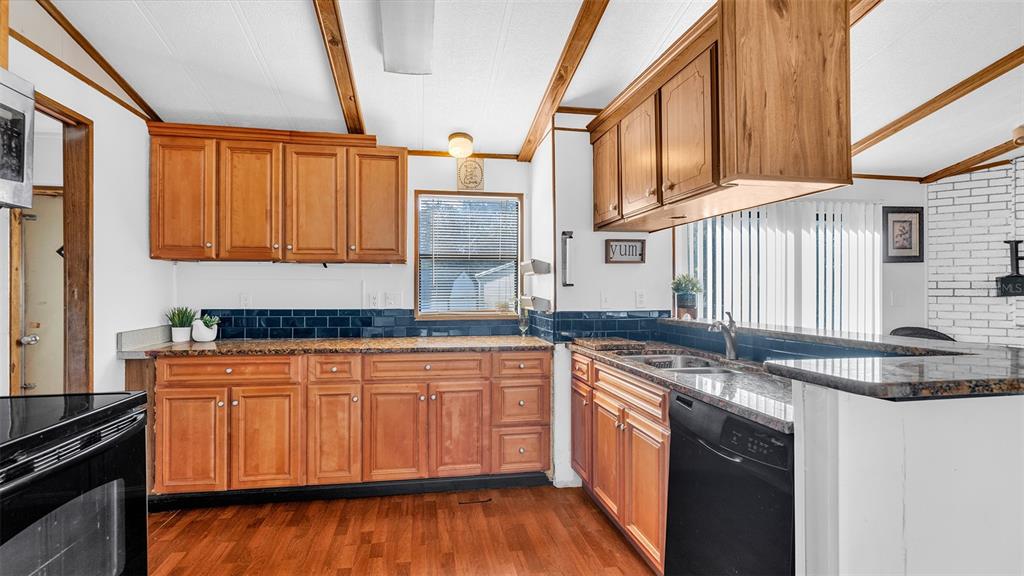 13035 Jack Terrace Hudson, FL 34669 - Photo 7 of 18 a kitchen with stainless steel appliances granite countertop a sink stove and cabinets