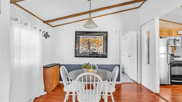 a view of a hallway with furniture and front door