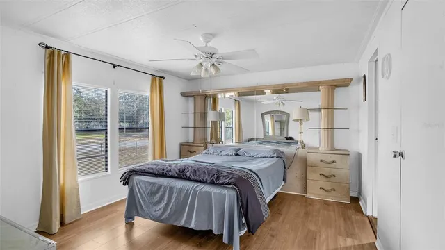a bedroom with a large bed and a window