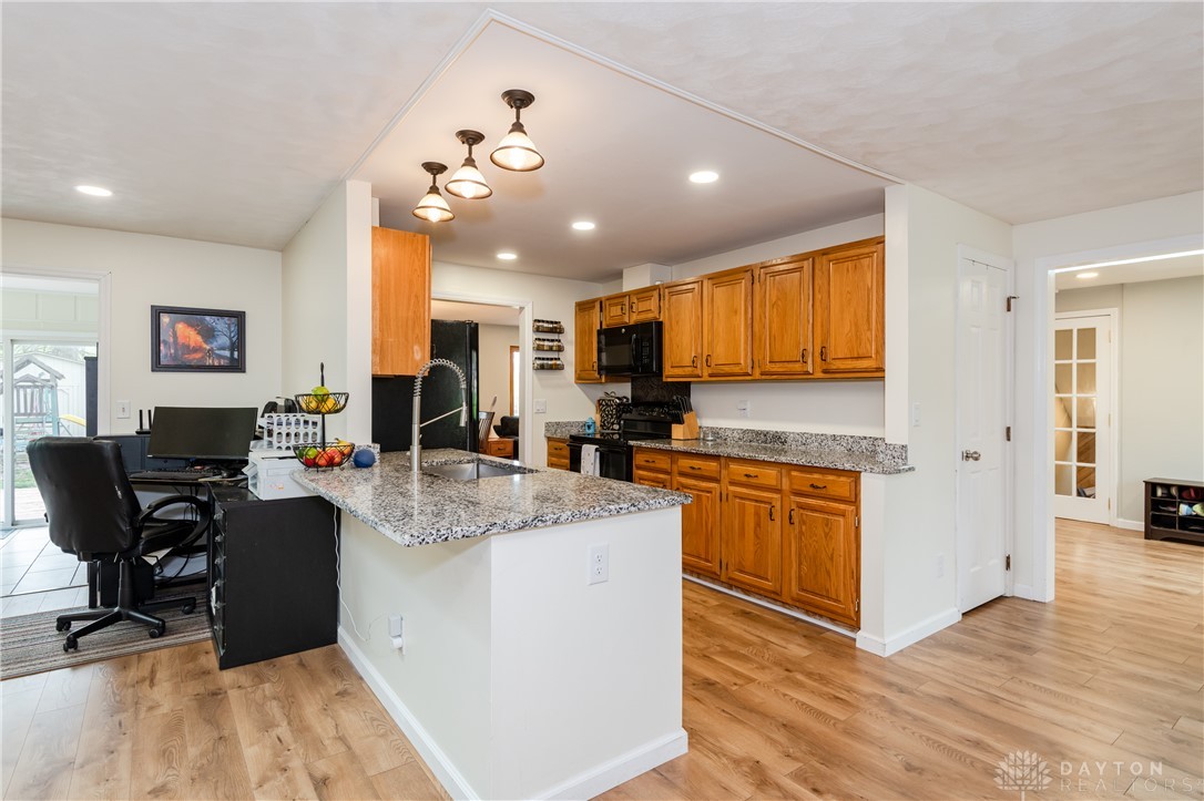 728 Chipplegate Drive Centerville, OH 45459 - Photo 12 of 30 This bright kitchen features ample counter space and warm wooden cabinetry.