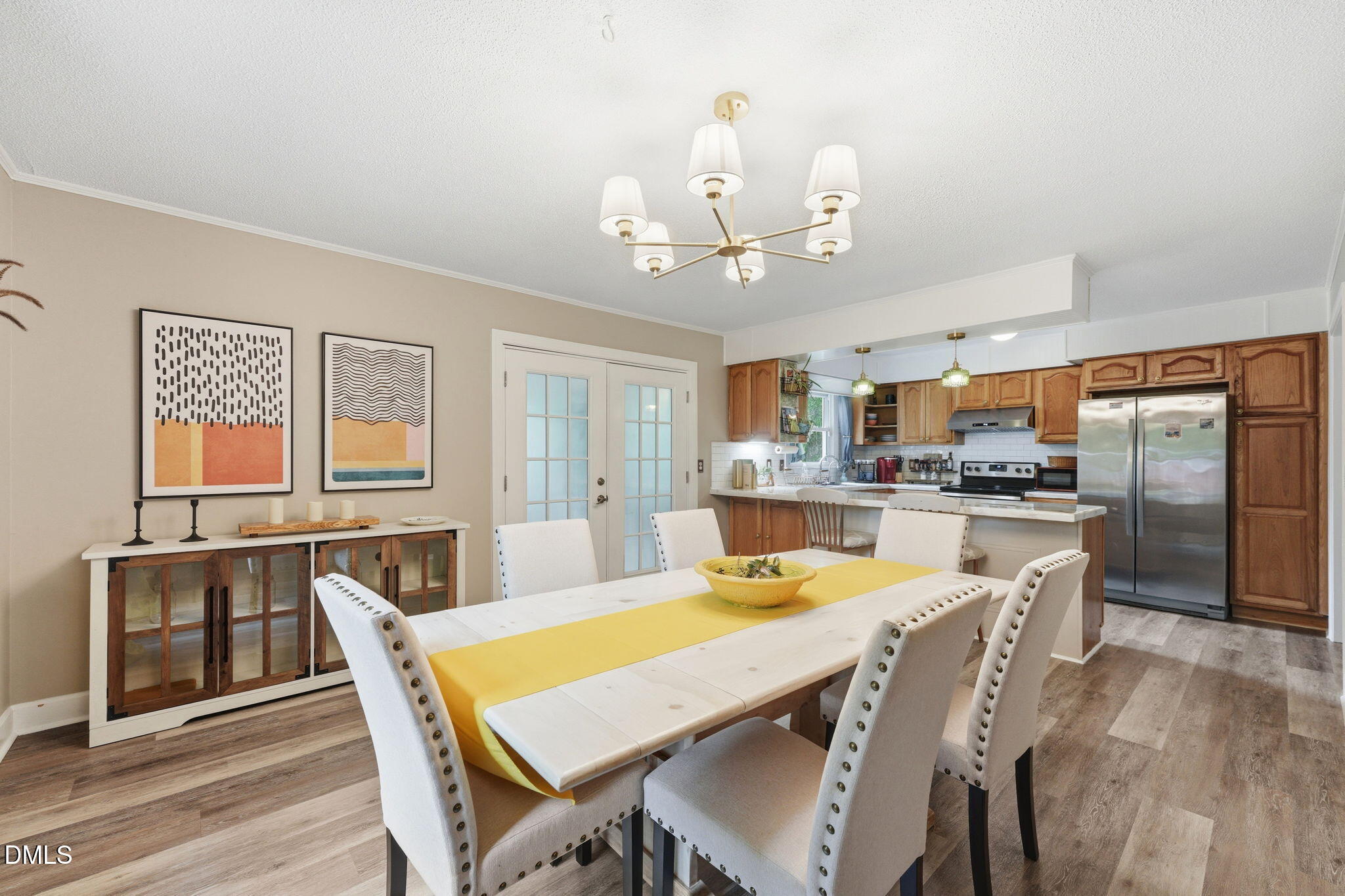 3200 Mill Creek Road Efland, NC 27243 - Photo 28 of 44 a view of a dining room with furniture a kitchen and chandelier