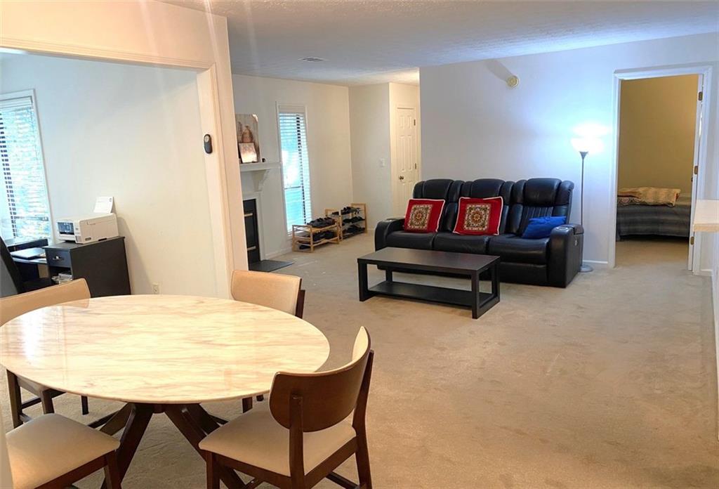 3934 Woodridge Way Tucker, GA 30084 - Photo 13 of 75 a living room with furniture and a table