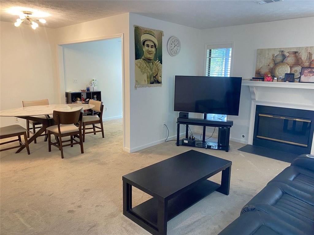 3934 Woodridge Way Tucker, GA 30084 - Photo 14 of 75 a living room with furniture a rug and a window
