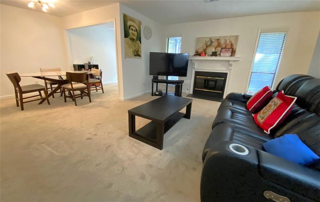 3934 Woodridge Way Tucker, GA 30084 - Photo 15 of 75 a living room with furniture fireplace and rug