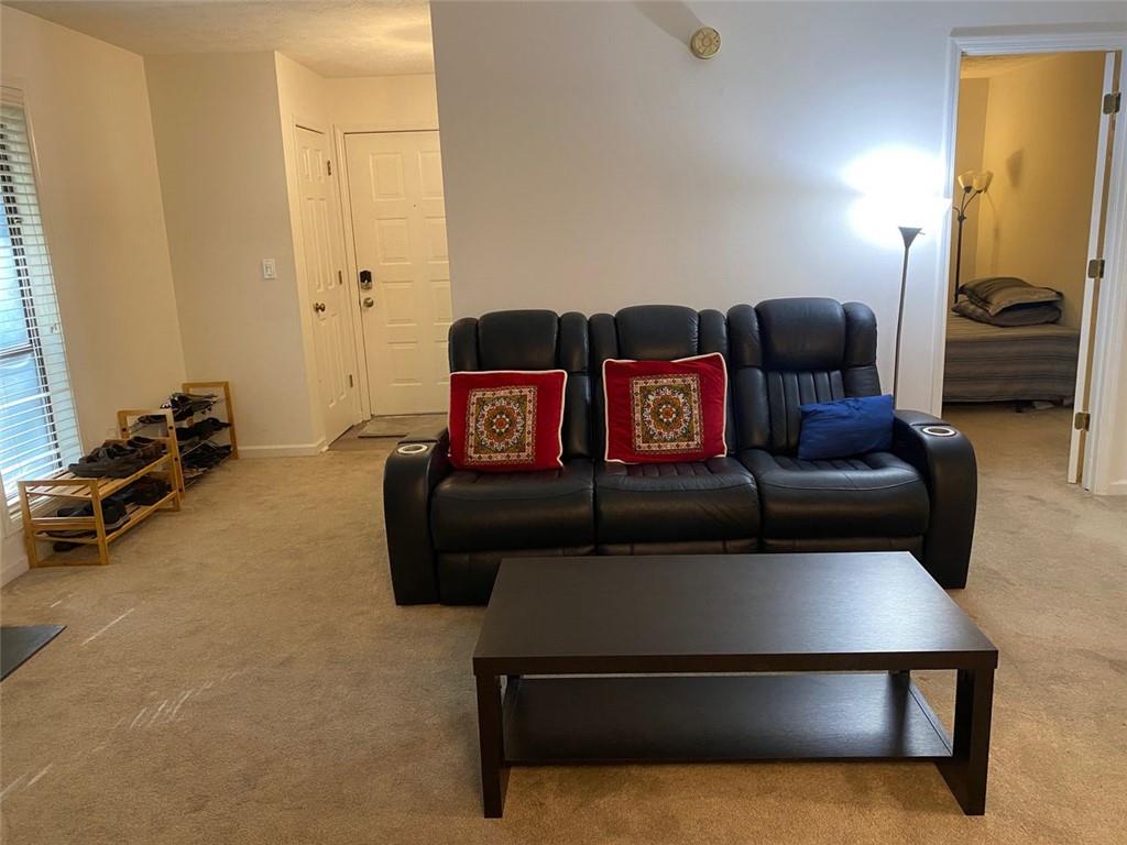 3934 Woodridge Way Tucker, GA 30084 - Photo 24 of 75 a living room with furniture and a flat screen tv