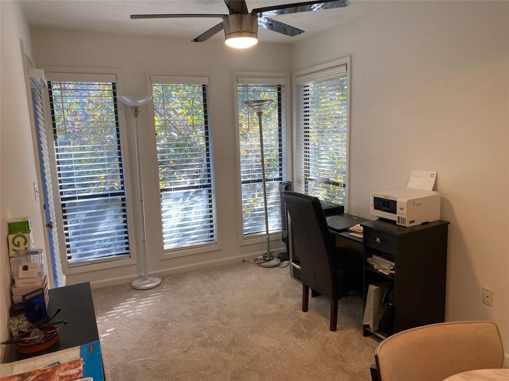 3934 Woodridge Way Tucker, GA 30084 - Photo 26 of 75 a view of a workspace with furniture and a window