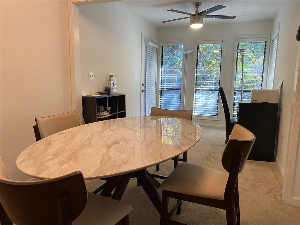 3934 Woodridge Way Tucker, GA 30084 - Photo 27 of 75 a view of a dining room with furniture and window