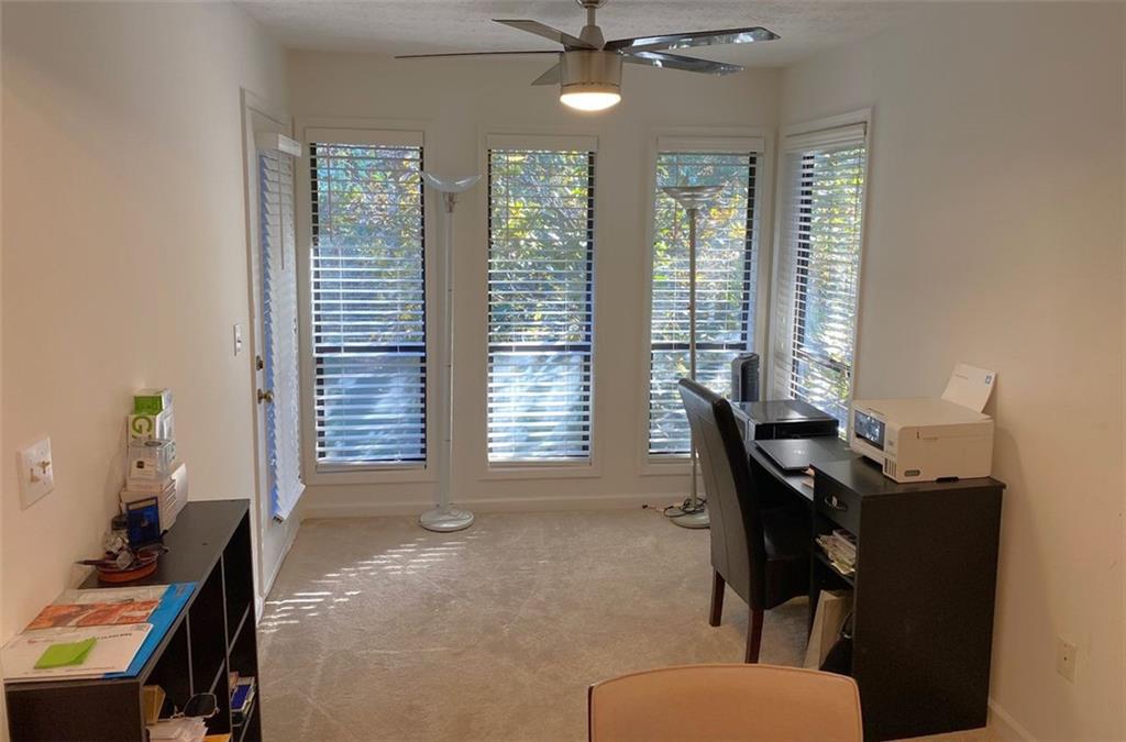 3934 Woodridge Way Tucker, GA 30084 - Photo 29 of 75 a view of a workspace with furniture and a window