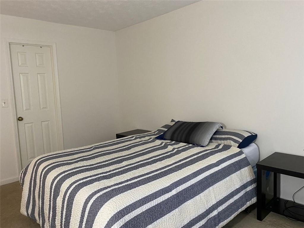 3934 Woodridge Way Tucker, GA 30084 - Photo 30 of 75 a bedroom with a bed and a window