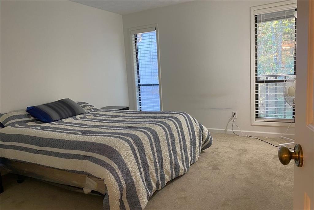 3934 Woodridge Way Tucker, GA 30084 - Photo 34 of 75 a bedroom with a bed and window