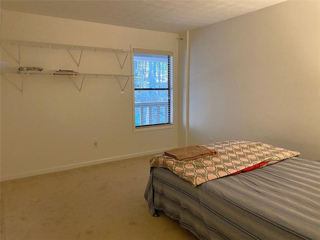 3934 Woodridge Way Tucker, GA 30084 - Photo 40 of 75 a bedroom with a bed and a window
