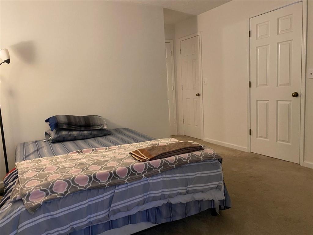 3934 Woodridge Way Tucker, GA 30084 - Photo 43 of 75 a bedroom with a bed and a dresser