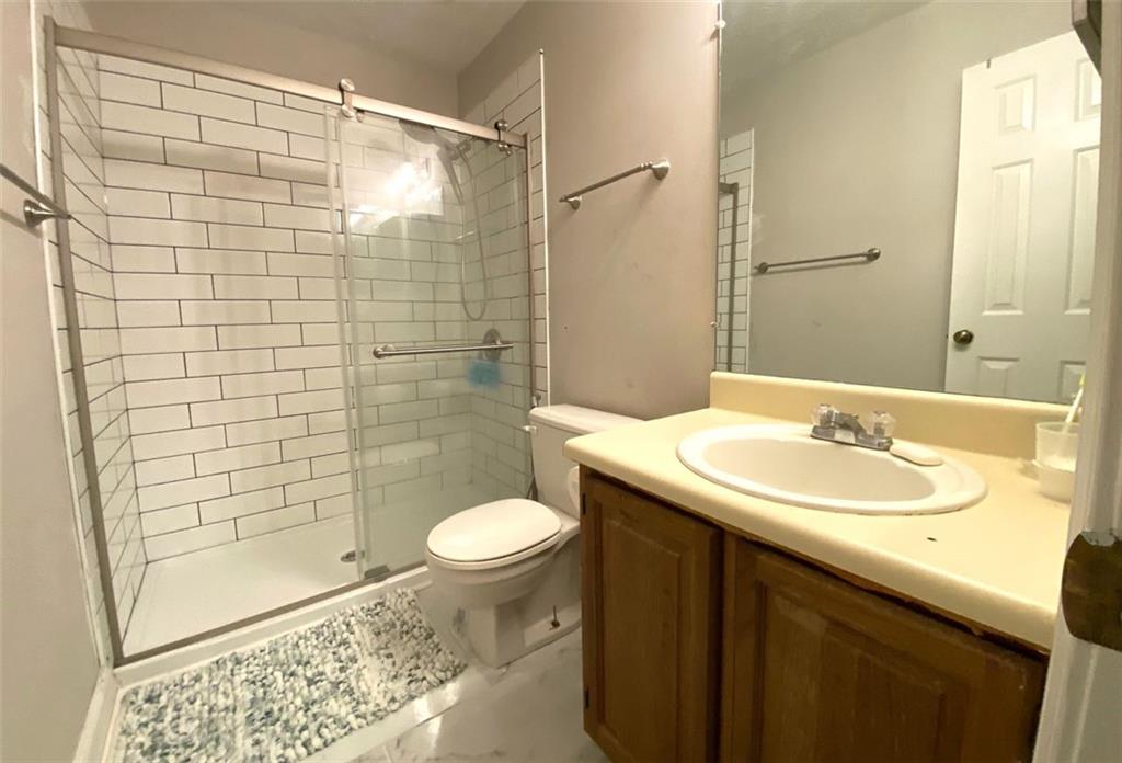 3934 Woodridge Way Tucker, GA 30084 - Photo 45 of 75 a bathroom with a sink and a mirror