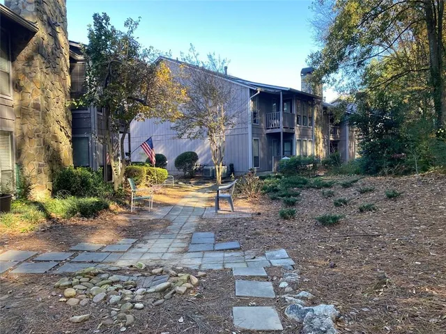 an aerial view of house with yard