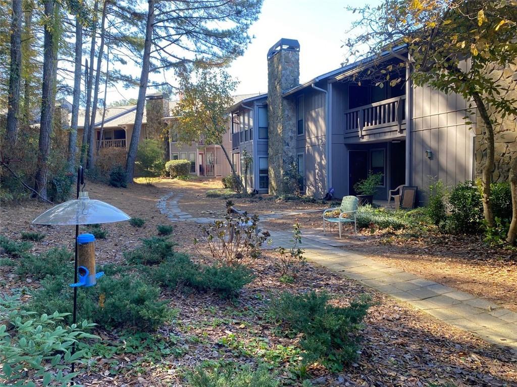 3934 Woodridge Way Tucker, GA 30084 - Photo 50 of 75 a view of a house with backyard and garden