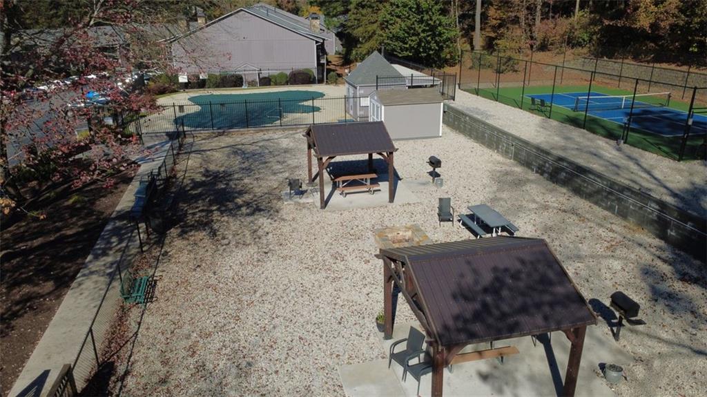 3934 Woodridge Way Tucker, GA 30084 - Photo 62 of 75 a view of backyard with seating space and trees