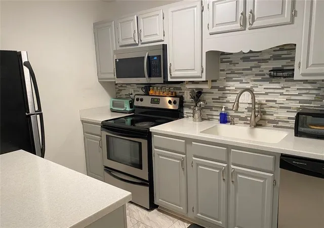 a utility room with washer and dryer