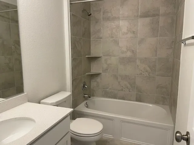 a bathroom with a sink a toilet and a bathtub