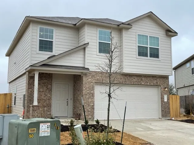 a front view of a house with parking