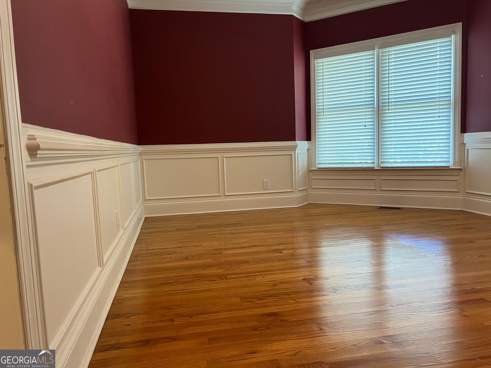 2301 Castlemaine Drive Northwest Duluth, GA 30097 - Photo 11 of 89 a view of an empty room with wooden floor and a window