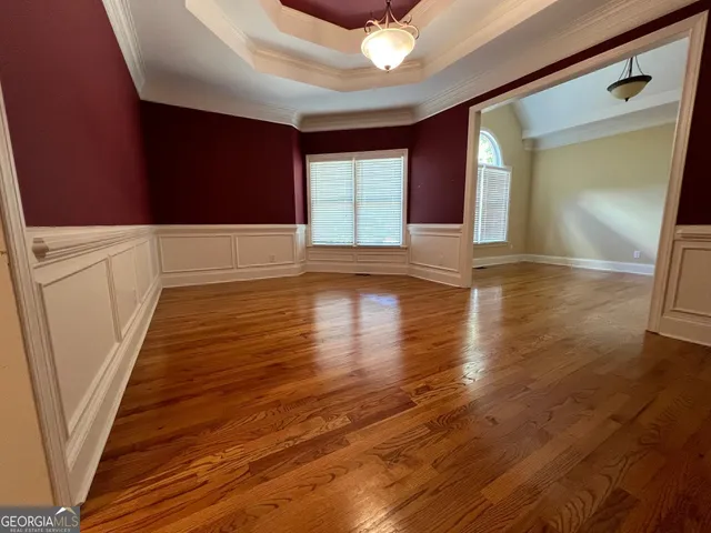 a view of gallery with wooden floor