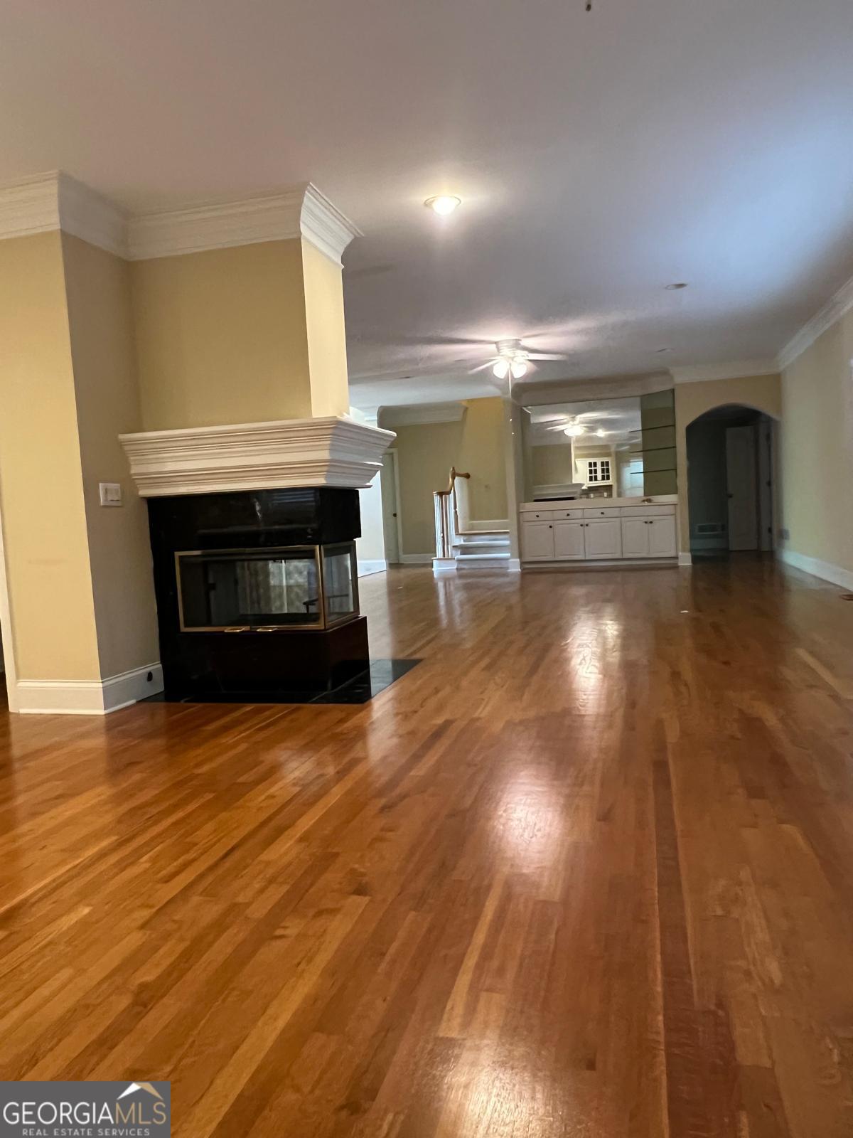 2301 Castlemaine Drive Northwest Duluth, GA 30097 - Photo 16 of 89 an empty room with wooden floor fireplace and cabinet