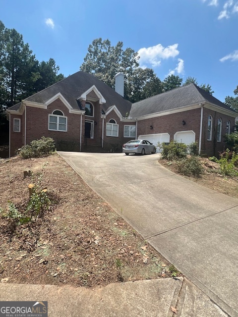 2301 Castlemaine Drive Northwest Duluth, GA 30097 - Photo 2 of 89 a front view of a house with a yard