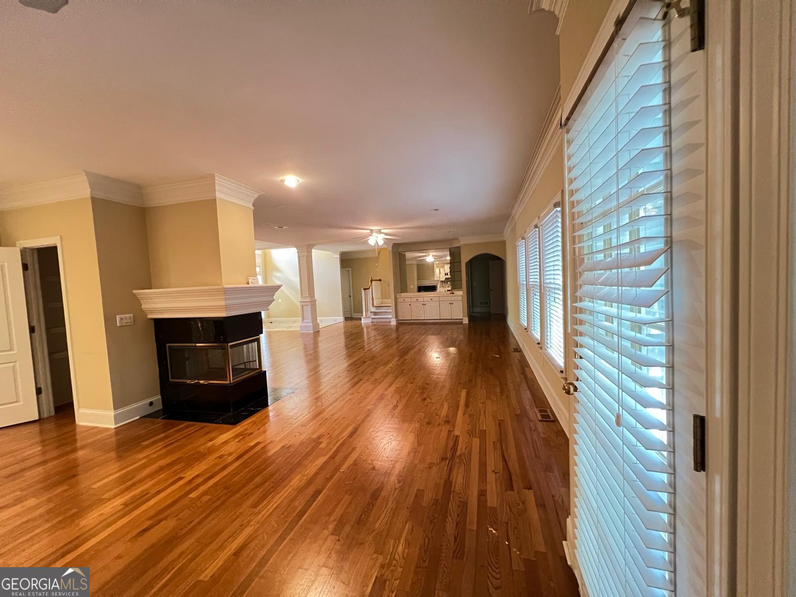 2301 Castlemaine Drive Northwest Duluth, GA 30097 - Photo 21 of 89 a living room with furniture and a wooden floor