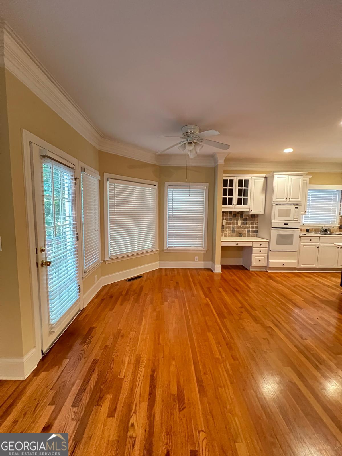 2301 Castlemaine Drive Northwest Duluth, GA 30097 - Photo 22 of 89 an empty room with wooden floor and windows
