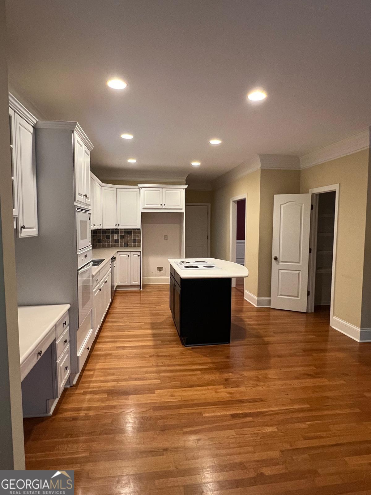 2301 Castlemaine Drive Northwest Duluth, GA 30097 - Photo 25 of 89 a large kitchen with stainless steel appliances kitchen island a large counter top and a stove