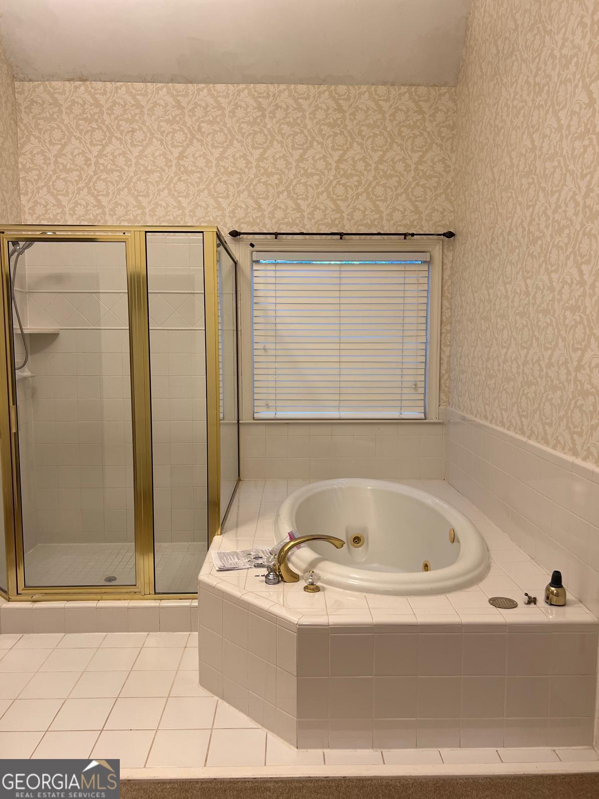 2301 Castlemaine Drive Northwest Duluth, GA 30097 - Photo 37 of 89 a bathroom with bathtub and shower