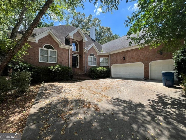 2301 Castlemaine Drive Northwest Duluth, GA 30097 - Photo 4 of 89 a front view of a house with a yard and garage