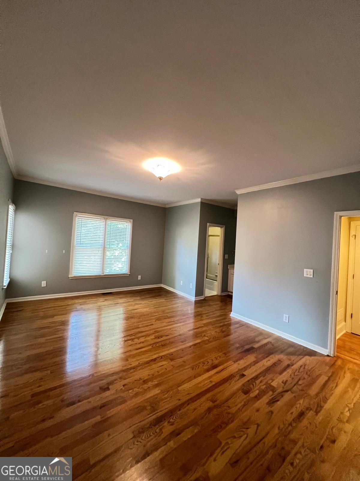 2301 Castlemaine Drive Northwest Duluth, GA 30097 - Photo 41 of 89 a view of an empty room with window and wooden floor