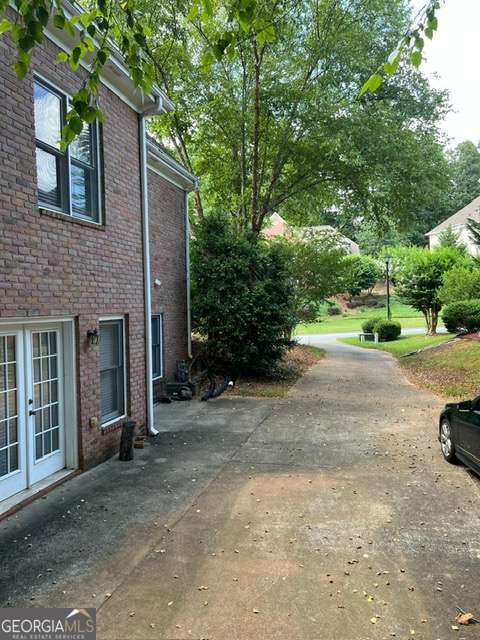 2301 Castlemaine Drive Northwest Duluth, GA 30097 - Photo 6 of 89 a view of a car parked on the side of the road