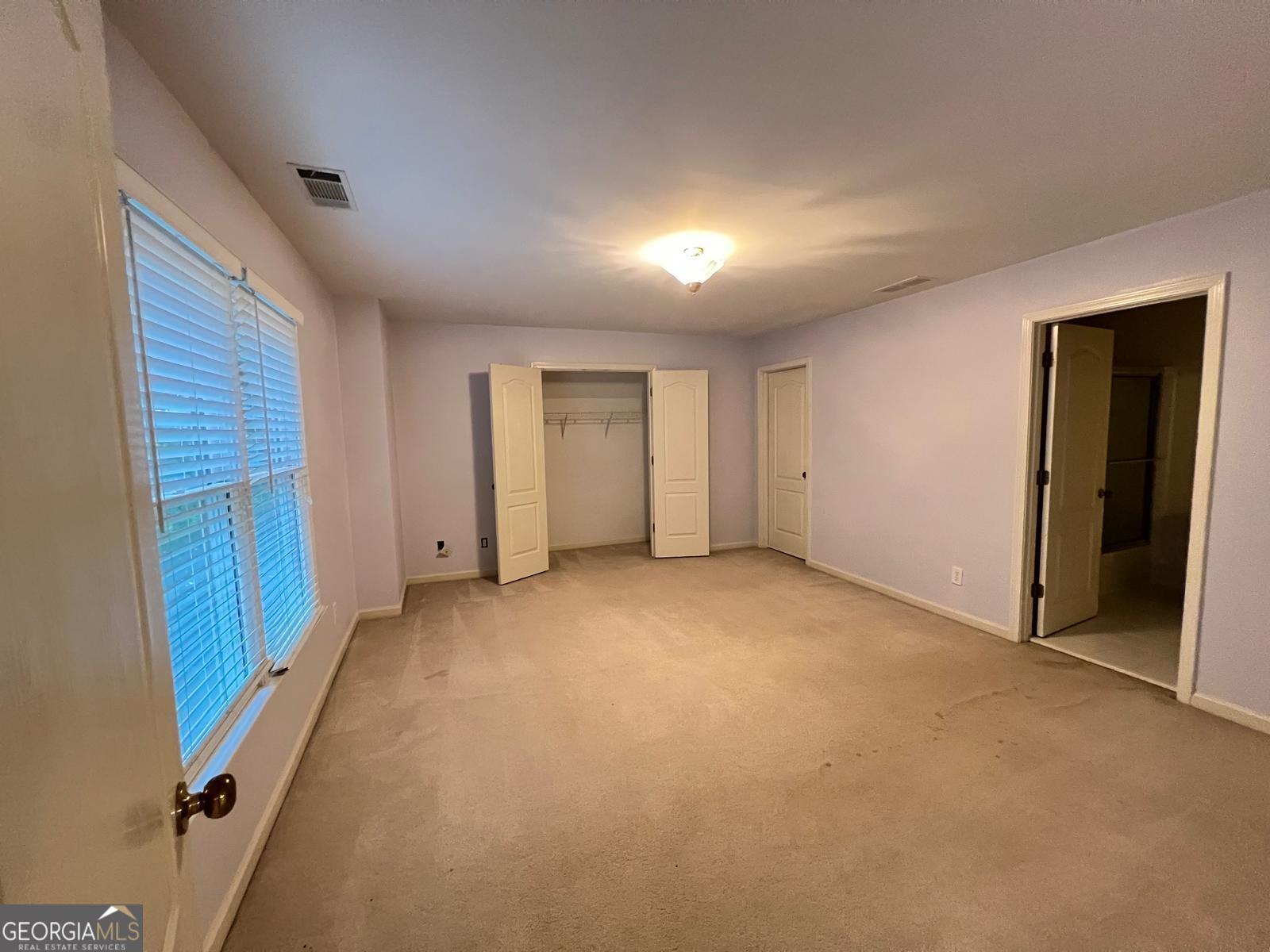 2301 Castlemaine Drive Northwest Duluth, GA 30097 - Photo 67 of 89 a view of an empty room with a closet
