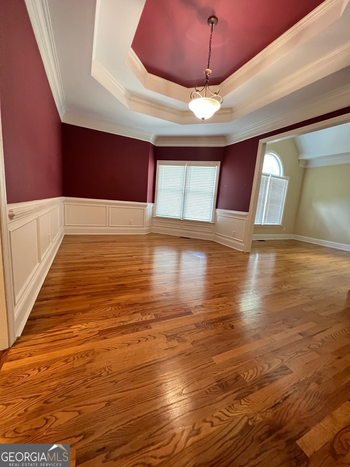 2301 Castlemaine Drive Northwest Duluth, GA 30097 - Photo 8 of 89 a view of an empty room with window and wooden floor