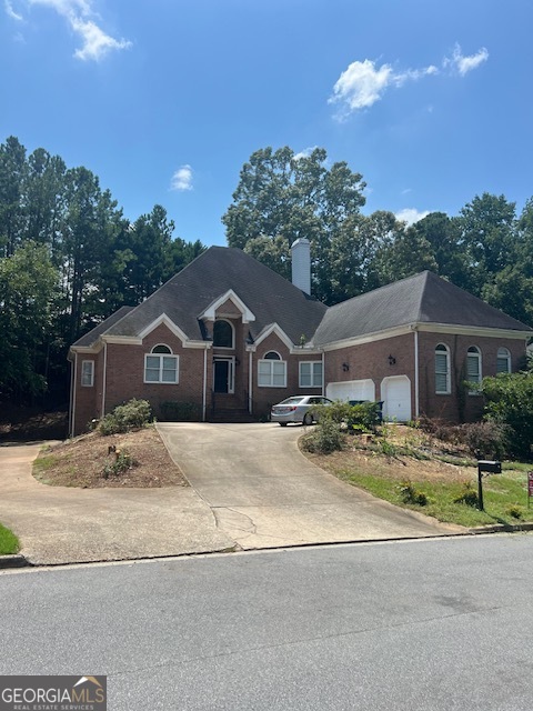 2301 Castlemaine Drive Northwest Duluth, GA 30097 - Photo 88 of 89 a front view of a house with a yard and garage