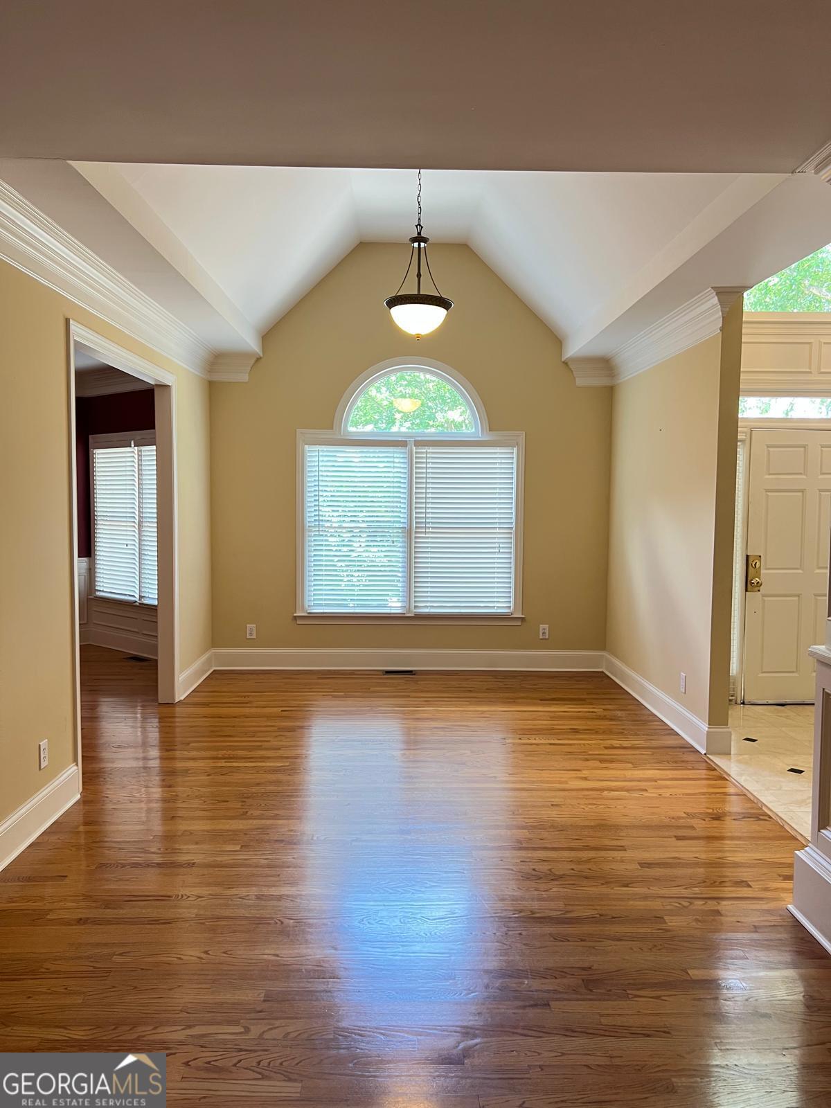 2301 Castlemaine Drive Northwest Duluth, GA 30097 - Photo 10 of 89 an empty room with wooden floor and windows