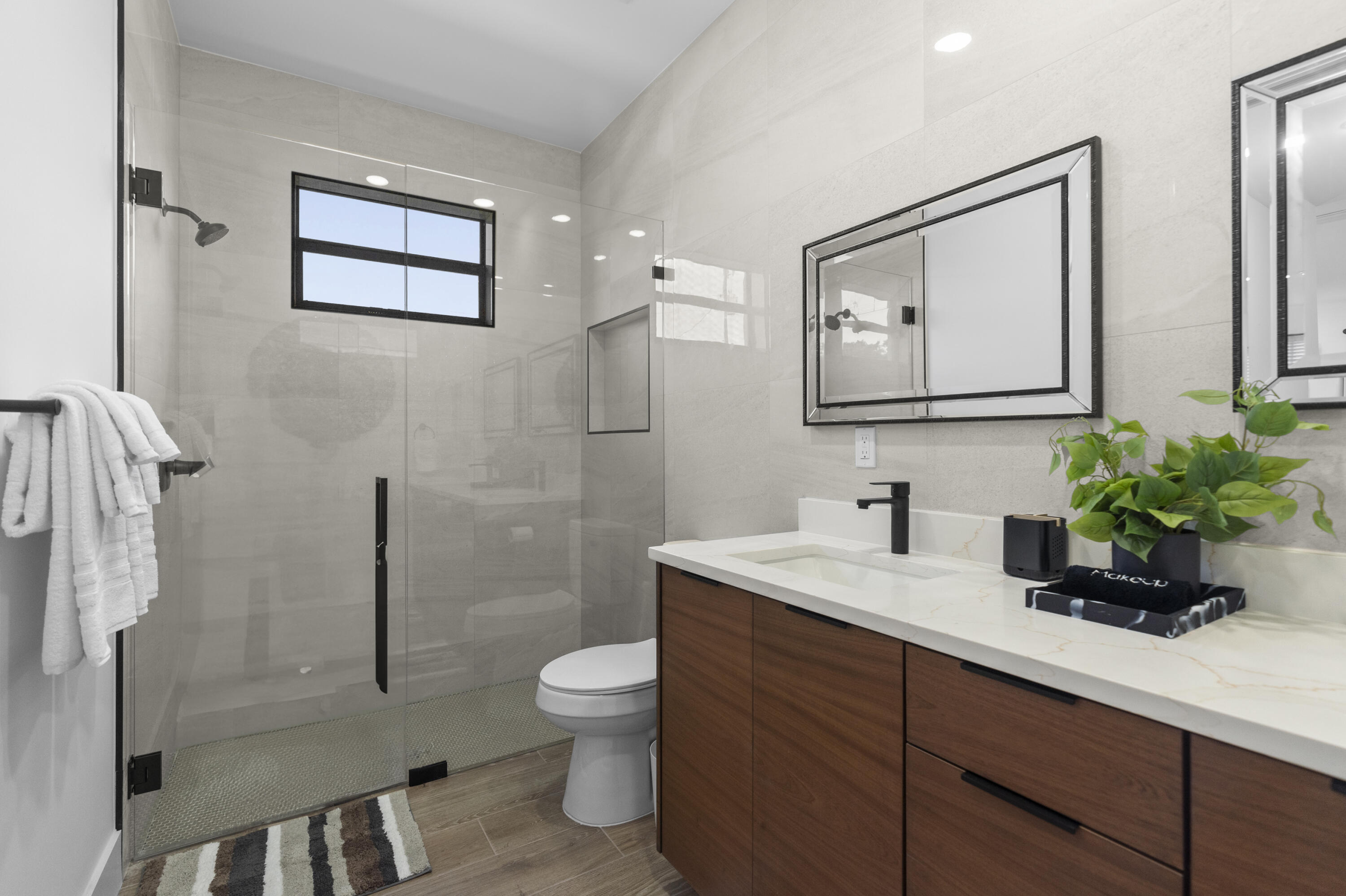 601 Southwest 3rd Street Delray Beach, FL 33444 - Photo 39 of 75 a bathroom with a toilet sink and mirror